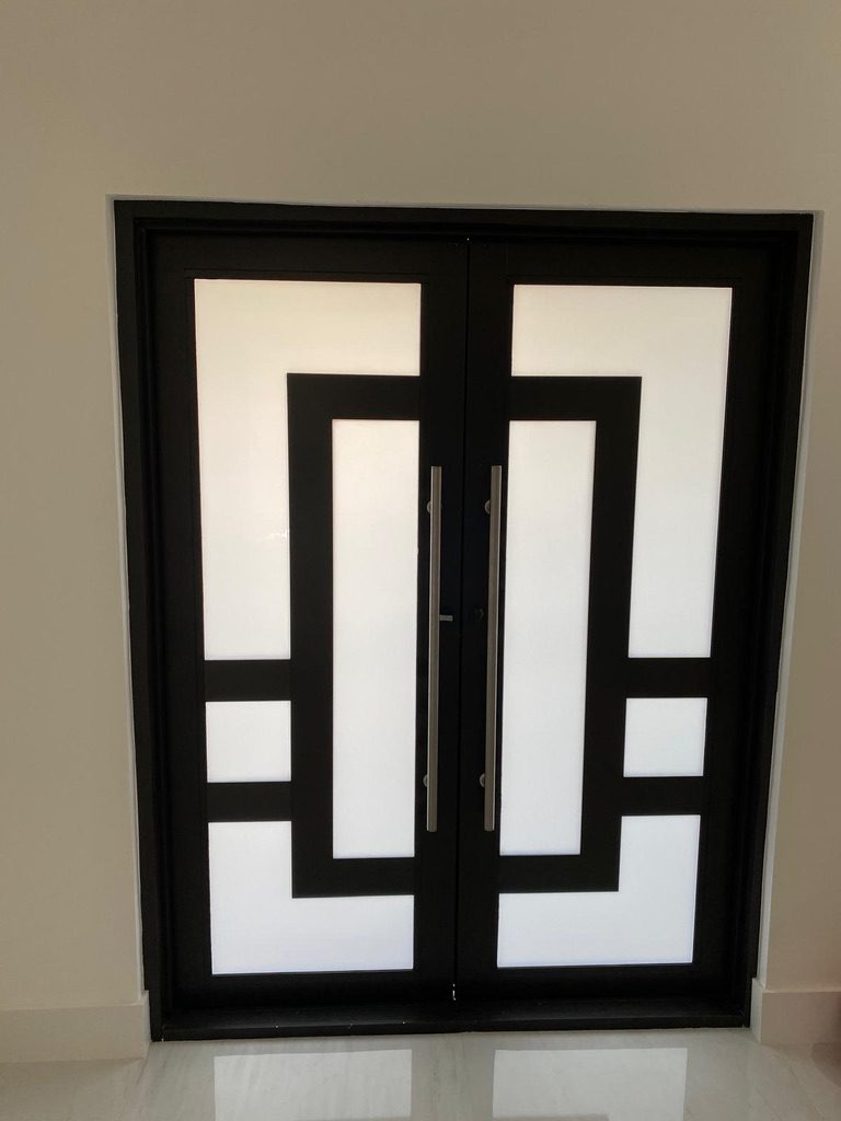 Modern double glass entry doors with frosted glass and long pull handles